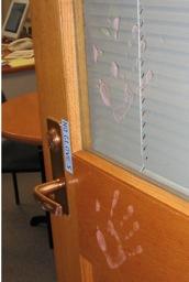 handprints on Elena's office door